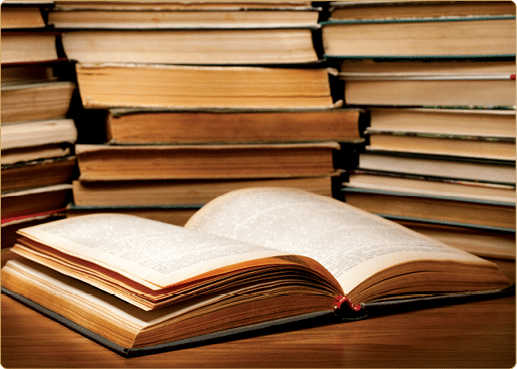 A stack of old books on the table 